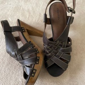 Dark brown, high heeled sandals, size 7! Used and in great condition.
